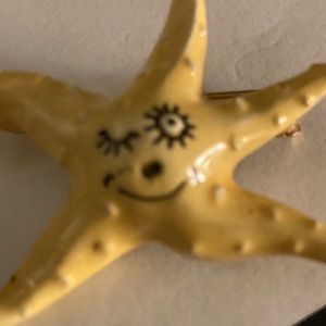 Yellow winking Starfish pin